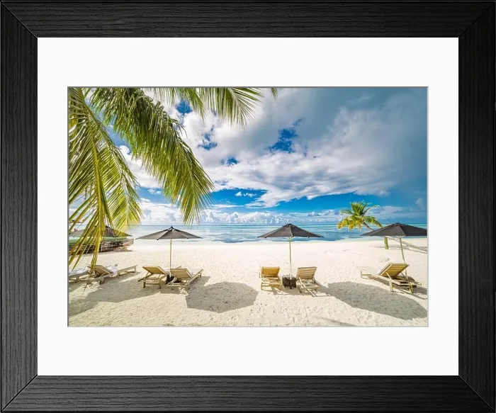 Framed Print : Tourism vacation landscape. Luxurious beach resort and beach chairs or loungers under umbrellas with palm trees and blue sky. Summer leisure carefree Framed Print : Tourism vacation landscape. Luxurious beach resort and beach chairs or loungers under umbrellas with palm trees and blue sky. Summer leisure carefree