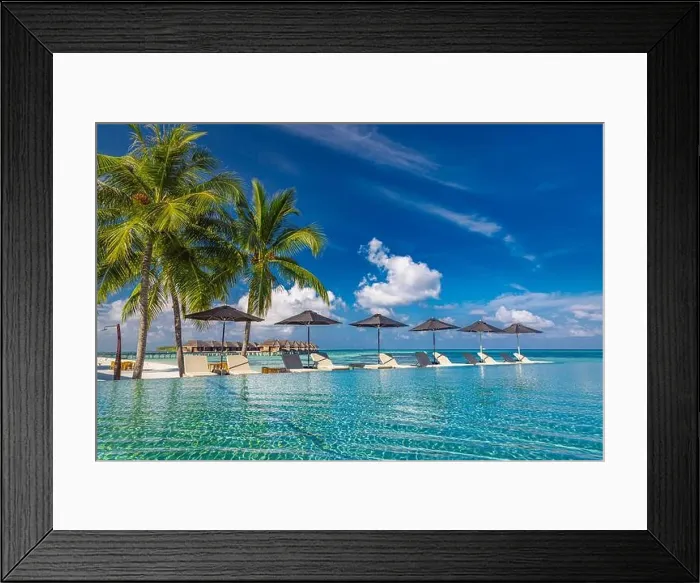 Framed Print : Summer luxury tourism landscape. Luxurious beach resort swimming pool reflection and beach chairs loungers, umbrellas palm trees blue sky poolside Framed Print : Summer luxury tourism landscape. Luxurious beach resort swimming pool reflection and beach chairs loungers, umbrellas palm trees blue sky poolside