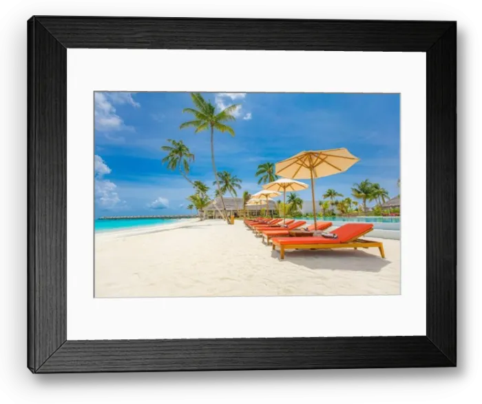 Framed Print : Outdoor tourism landscape. Luxurious beach resort with swimming pool and beach chairs or loungers under umbrellas with palm trees and blue sky. Summer Framed Print : Outdoor tourism landscape. Luxurious beach resort with swimming pool and beach chairs or loungers under umbrellas with palm trees and blue sky. Summer