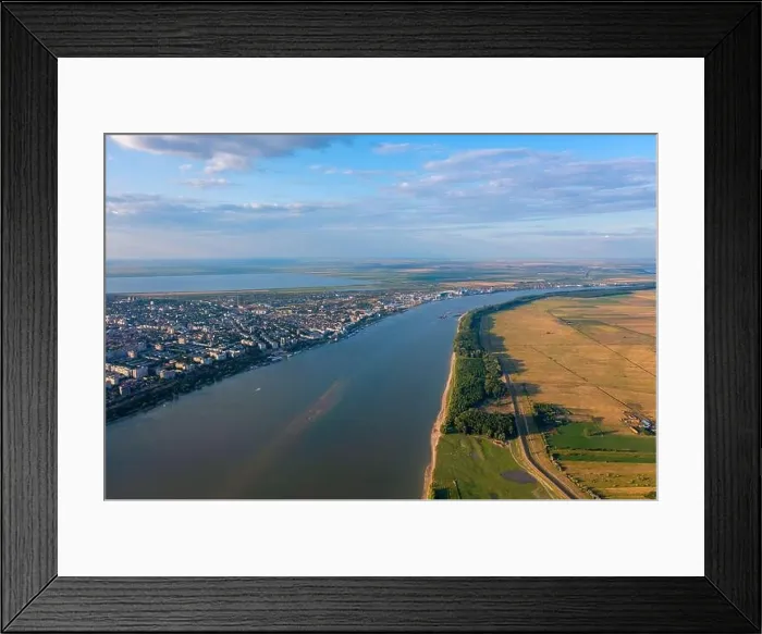 Framed Print : Aerial view of Galati City, Romania. Danube River near city with sunset warm light Framed Print : Aerial view of Galati City, Romania. Danube River near city with sunset warm light