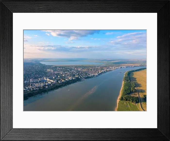 Framed Print : Aerial view of Galati City, Romania. Danube River near city with sunset warm light Framed Print : Aerial view of Galati City, Romania. Danube River near city with sunset warm light