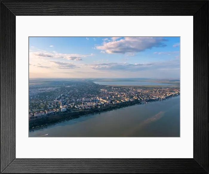 Framed Print : Aerial view of Galati City, Romania. Danube River near city with sunset warm light Framed Print : Aerial view of Galati City, Romania. Danube River near city with sunset warm light