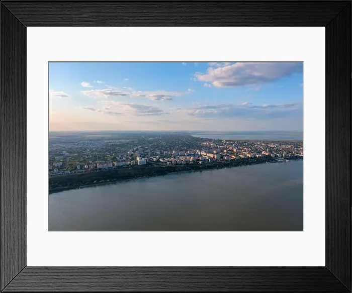 Framed Print : Aerial view of Galati City, Romania. Danube River near city with sunset warm light