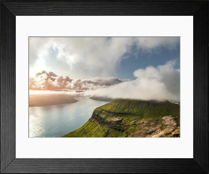 Framed Print : Foggy mountain peaks and clouds covering sea and mountains. Panoramical view from famous place - Sornfelli on Streymoy island, Faroe islands, Denmark Framed Print : Foggy mountain peaks and clouds covering sea and mountains. Panoramical view from famous place - Sornfelli on Streymoy island, Faroe islands, Denmark