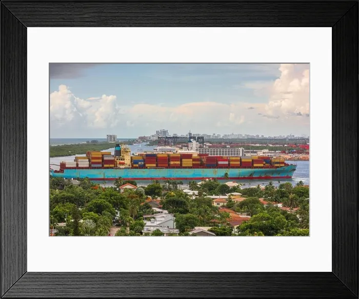 Framed Print : A cargo ship passes through the rivers of Ft. Lauderdale, Florida, USA Framed Print : A cargo ship passes through the rivers of Ft. Lauderdale, Florida, USA