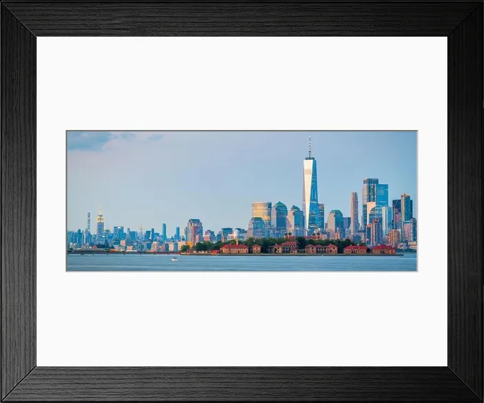 Framed Print : New York, New York, USA skyline from the harbor with Ellis Island at dusk Framed Print : New York, New York, USA skyline from the harbor with Ellis Island at dusk