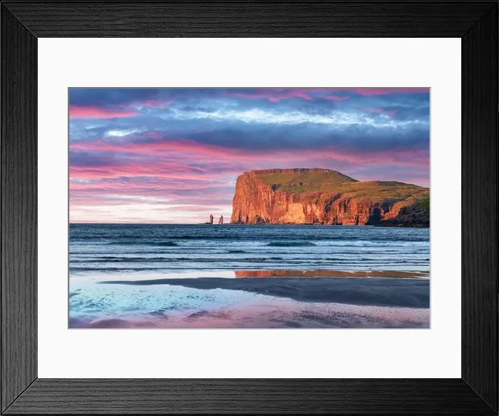 Framed Print : Incredible sunset in low tide time on Atlantic ocean coast near village Tjornuvik. Famous rock formations Risin and Kellingin Eidiskollur on backgroun Framed Print : Incredible sunset in low tide time on Atlantic ocean coast near village Tjornuvik. Famous rock formations Risin and Kellingin Eidiskollur on backgroun