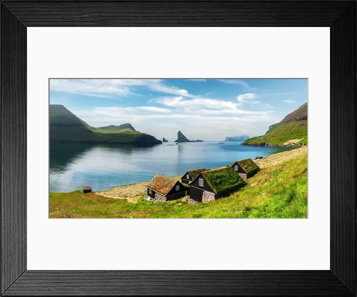 Framed Print : Picturesque view of tradicional faroese grass-covered houses in the village Bour. Drangarnir and Tindholmur sea stacks on background. Vagar island, Fa Framed Print : Picturesque view of tradicional faroese grass-covered houses in the village Bour. Drangarnir and Tindholmur sea stacks on background. Vagar island, Fa