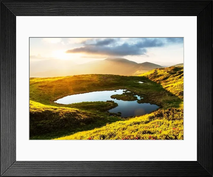 Framed Print : Mountain lake on sunrise time. Picturesque summer landscape with green mountain hills and sun rays in morning sky. Carpathian mountains Framed Print : Mountain lake on sunrise time. Picturesque summer landscape with green mountain hills and sun rays in morning sky. Carpathian mountains