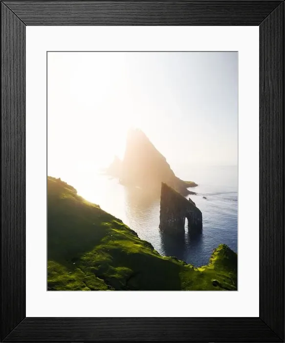 Framed Print : Aerial drone flying over Drangarnir and Tindholmur sea stacks Framed Print : Aerial drone flying over Drangarnir and Tindholmur sea stacks