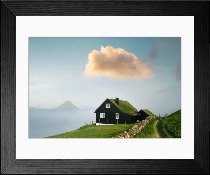 Framed Print : Foggy morning view of a house with typical grass roof Framed Print : Foggy morning view of a house with typical grass roof