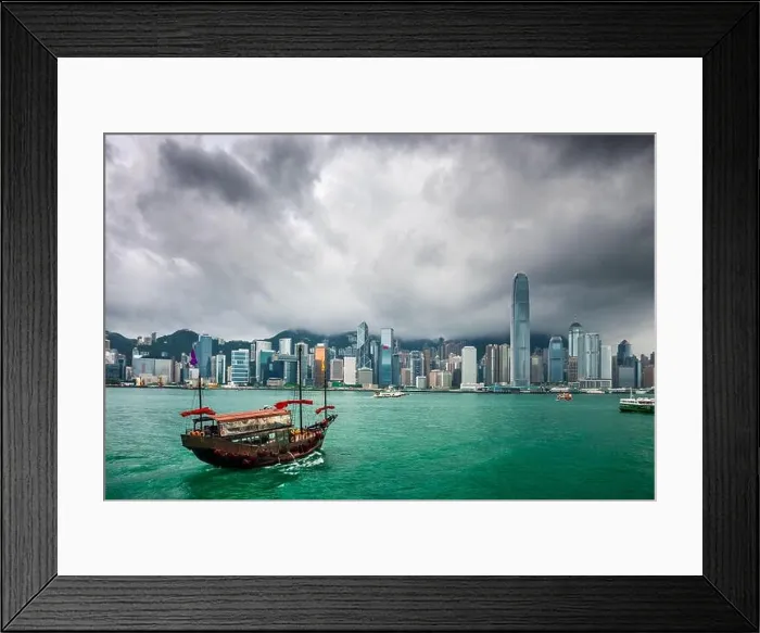 Framed Print : Hong Kong, China downtown cityscape from the harbor at dusk Framed Print : Hong Kong, China downtown cityscape from the harbor at dusk