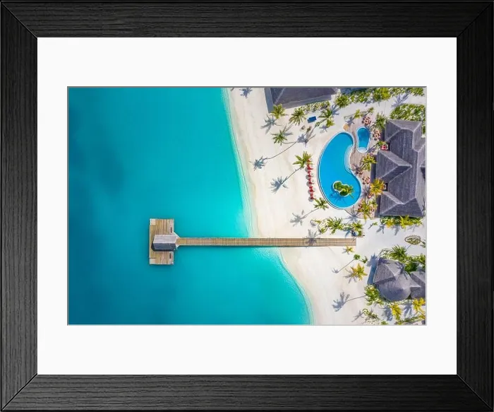 Framed Print : Aerial view of Maldives island, luxury water villas resort and wooden pier. Beautiful sky and ocean lagoon beach background. Summer vacation holiday Framed Print : Aerial view of Maldives island, luxury water villas resort and wooden pier. Beautiful sky and ocean lagoon beach background. Summer vacation holiday