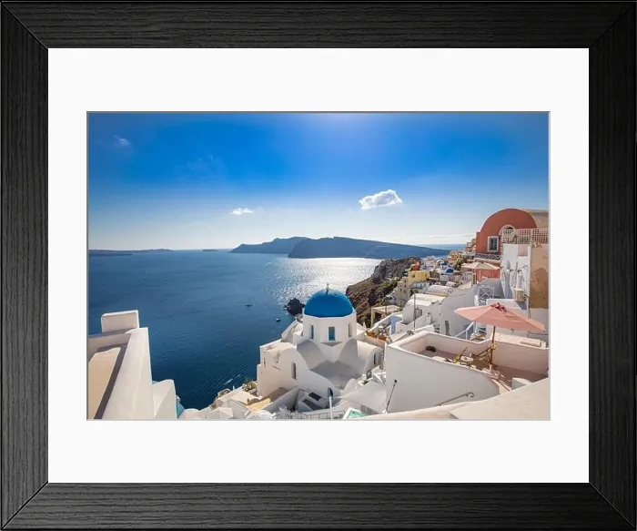 Framed Print : Amazing panoramic landscape, luxury travel vacation. Oia town on Santorini island, Greece. Traditional and famous houses and churches with blue domes Framed Print : Amazing panoramic landscape, luxury travel vacation. Oia town on Santorini island, Greece. Traditional and famous houses and churches with blue domes