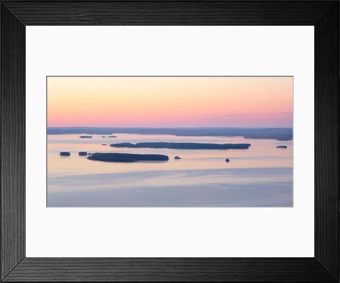 Framed Print : Scenic lake landscape with sunset and beautiful islands island at mood summer evening in National park Finland Framed Print : Scenic lake landscape with sunset and beautiful islands island at mood summer evening in National park Finland