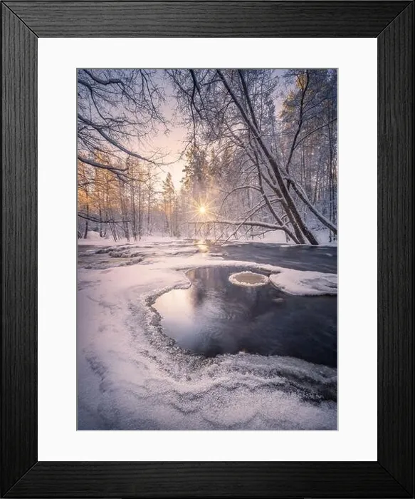 Framed Print : Scenic winter landscape with flowing river and morning light in Finland. Snowy trees Framed Print : Scenic winter landscape with flowing river and morning light in Finland. Snowy trees