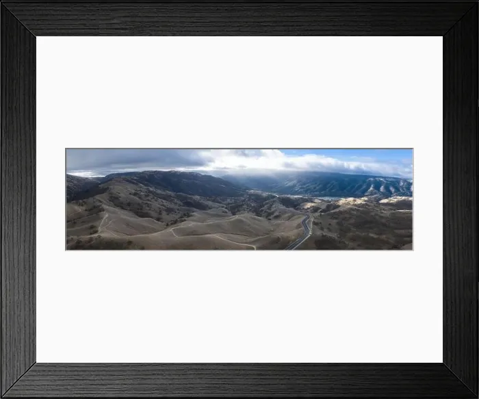 Framed Print : A scenic road winds through the rolling hills of Livermore, California. This beautiful part of the Bay Area is known for its wineries and breweries Framed Print : A scenic road winds through the rolling hills of Livermore, California. This beautiful part of the Bay Area is known for its wineries and breweries