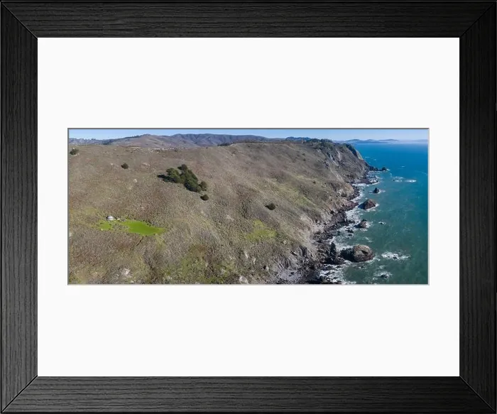 Framed Print : The Pacific Ocean washes against the rugged shoreline of northern California on a beautiful day. The Pacific Coast Highway runs along this coastline Framed Print : The Pacific Ocean washes against the rugged shoreline of northern California on a beautiful day. The Pacific Coast Highway runs along this coastline