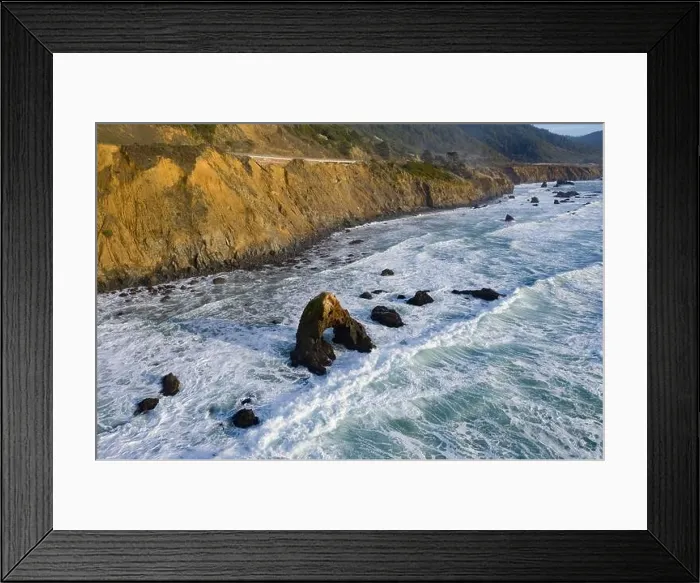 Framed Print : The Pacific Ocean washes against the rugged shoreline of northern California on a beautiful day. The Pacific Coast Highway runs along this area Framed Print : The Pacific Ocean washes against the rugged shoreline of northern California on a beautiful day. The Pacific Coast Highway runs along this area