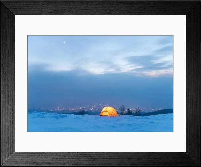 Framed Print : Yellow tent lighted from the inside against the backdrop of glowing city lights in fog. Amazing snowy landscape. Tourists camp in winter mountains Framed Print : Yellow tent lighted from the inside against the backdrop of glowing city lights in fog. Amazing snowy landscape. Tourists camp in winter mountains