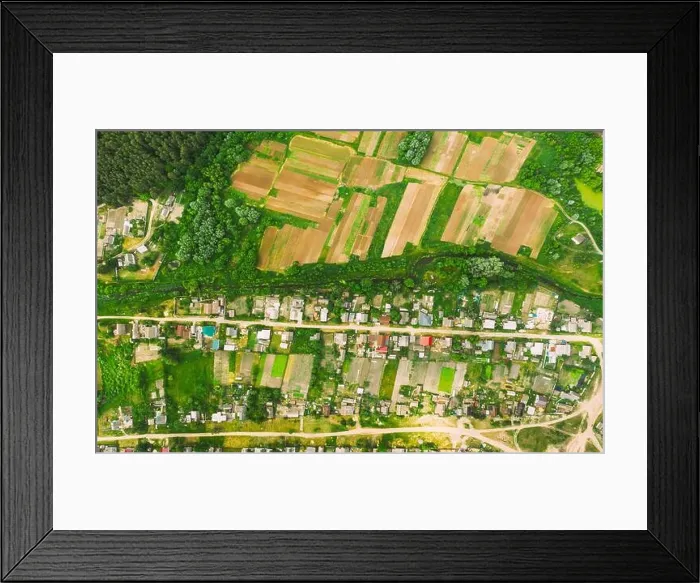 Framed Print : Aerial View Of Vegetable Gardens In Small Town Or Village. Skyline In Summer Evening. Village Garden Beds In Bird's-eye View Framed Print : Aerial View Of Vegetable Gardens In Small Town Or Village. Skyline In Summer Evening. Village Garden Beds In Bird's-eye View