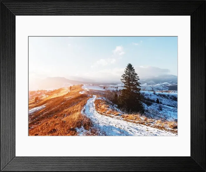 Framed Print : Amazing view of mountains range and meadows of the countryside in spring time. Clear sky and snowy road glowing with bright sunset light Framed Print : Amazing view of mountains range and meadows of the countryside in spring time. Clear sky and snowy road glowing with bright sunset light
