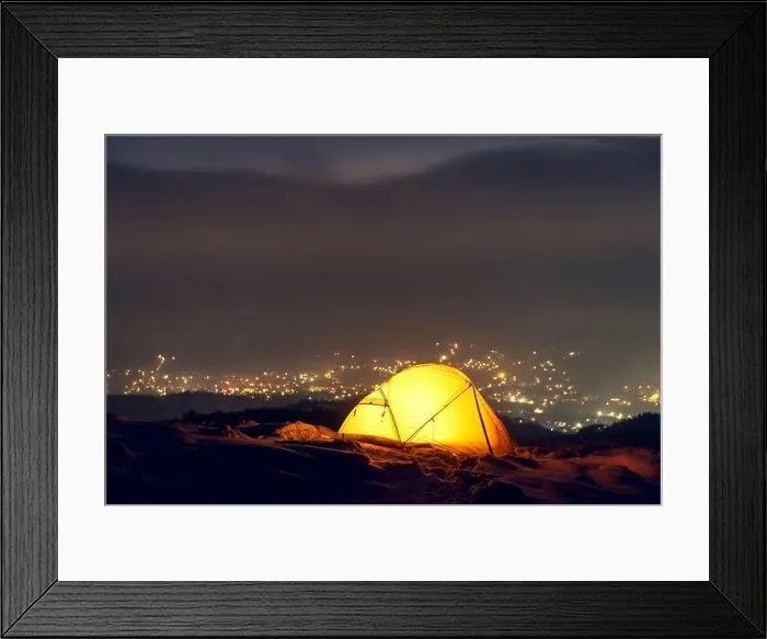 Framed Print : Yellow tent lighted from the inside against the backdrop of glowing city lights in fog. Amazing snowy landscape. Tourists camp in winter mountains Framed Print : Yellow tent lighted from the inside against the backdrop of glowing city lights in fog. Amazing snowy landscape. Tourists camp in winter mountains