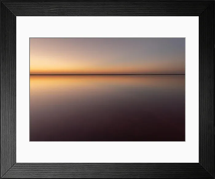 Framed Print : Tranquil minimalist landscape with smooth surface of the pink salt lake with calm water with horizon with clear sky in sunset time Framed Print : Tranquil minimalist landscape with smooth surface of the pink salt lake with calm water with horizon with clear sky in sunset time