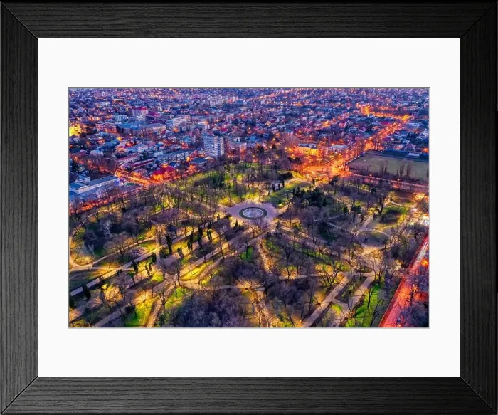 Framed Print : Galati, Romania - February 28, 2021: Aerial view of Galati City, Romania, at sunset with city lights on Framed Print : Galati, Romania - February 28, 2021: Aerial view of Galati City, Romania, at sunset with city lights on