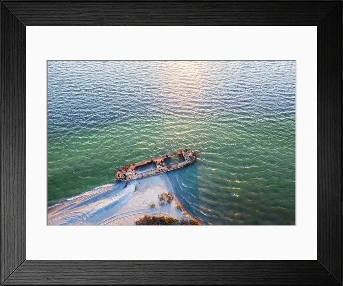 Framed Print : Old shipwreck reinforced concrete barge abandoned stand on beach on the coast of Black sea in Ukraine Framed Print : Old shipwreck reinforced concrete barge abandoned stand on beach on the coast of Black sea in Ukraine