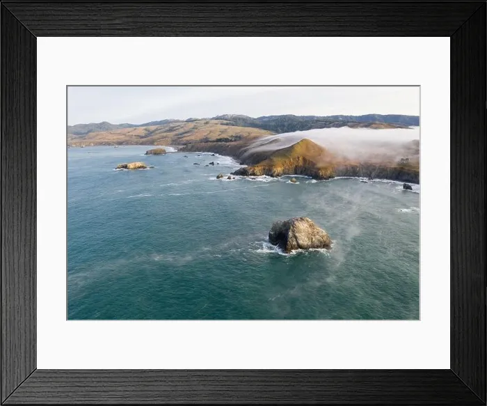 Framed Print : The Pacific Ocean washes against the scenic coastline of northern California in Sonoma. This region is often covered by a thick marine layer of mist Framed Print : The Pacific Ocean washes against the scenic coastline of northern California in Sonoma. This region is often covered by a thick marine layer of mist