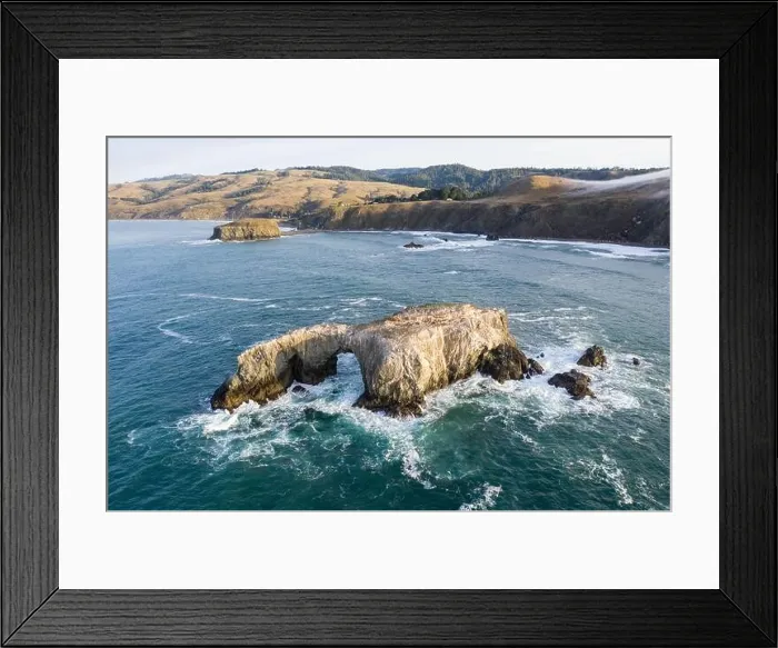 Framed Print : The Pacific Ocean washes against a sea stack off the northern California Sonoma coast. This region is often covered by a thick marine layer of mist Framed Print : The Pacific Ocean washes against a sea stack off the northern California Sonoma coast. This region is often covered by a thick marine layer of mist