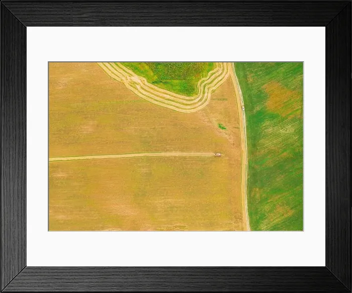 Framed Print : Aerial View Of Rural Landscape. Combine Harvester Working In Field, Collects Seeds. Harvesting Of Wheat In Late Summer. Agricultural Machine Collectin Framed Print : Aerial View Of Rural Landscape. Combine Harvester Working In Field, Collects Seeds. Harvesting Of Wheat In Late Summer. Agricultural Machine Collectin