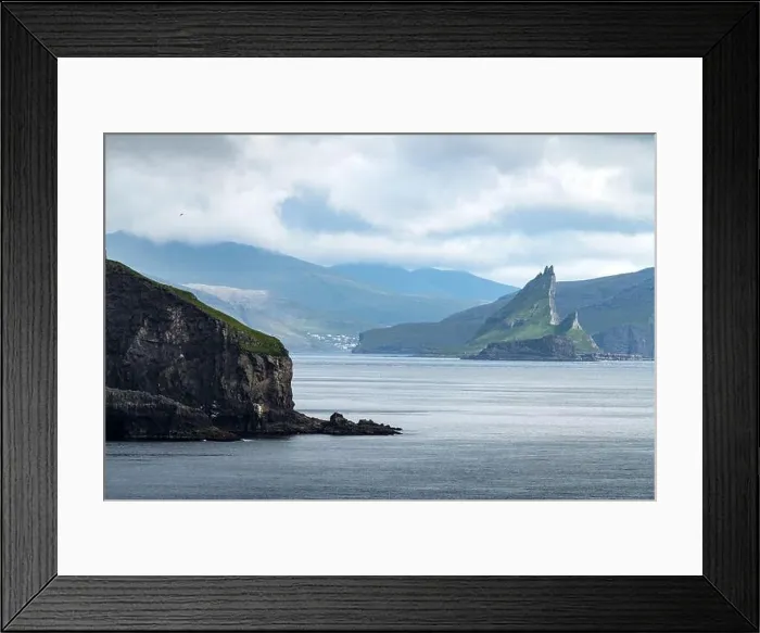 Framed Print : Dramatic view on Drangarnir and Tindholmur sea stacks in Atlantic ocean from Mykines island, Faroe Islands. Landscape photography Framed Print : Dramatic view on Drangarnir and Tindholmur sea stacks in Atlantic ocean from Mykines island, Faroe Islands. Landscape photography