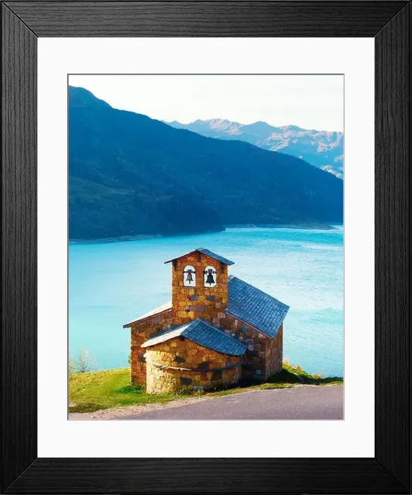Framed Print : Picturesque view of stone chapel on Roselend lake coast (Lac de Roselend) in France Alps (Auvergne-Rhone-Alpes). Landscape photography Framed Print : Picturesque view of stone chapel on Roselend lake coast (Lac de Roselend) in France Alps (Auvergne-Rhone-Alpes). Landscape photography