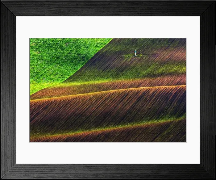 Framed Print : Rural spring landscape with colored striped hills. Green and brown waves of the agricultural fields of South Moravia, Czech Republic Framed Print : Rural spring landscape with colored striped hills. Green and brown waves of the agricultural fields of South Moravia, Czech Republic