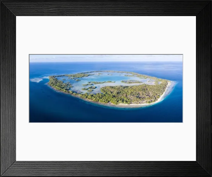 Framed Print : Seen from above, the many tropical islands within Raja Ampat, Indonesia, are surrounded by healthy coral reefs and high marine biodiversity Framed Print : Seen from above, the many tropical islands within Raja Ampat, Indonesia, are surrounded by healthy coral reefs and high marine biodiversity