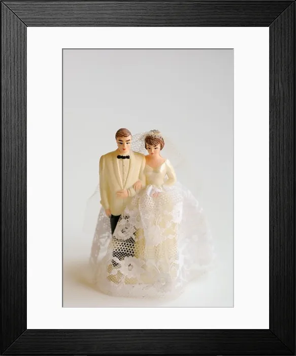 Framed Print : Studio shot of bride and groom figurines Framed Print : Studio shot of bride and groom figurines