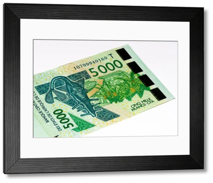 Framed Print : 5000 CFA franc bank note. CFA franc is used in 14 African countries Framed Print : 5000 CFA franc bank note. CFA franc is used in 14 African countries
