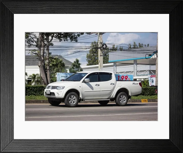 Framed Print : Chiangmai, Thailand - November 15 2018: Private car, Mitsubishi Triton Pickup Truck. On road no.1001, 8 km from Chiangmai Business Area Framed Print : Chiangmai, Thailand - November 15 2018: Private car, Mitsubishi Triton Pickup Truck. On road no.1001, 8 km from Chiangmai Business Area