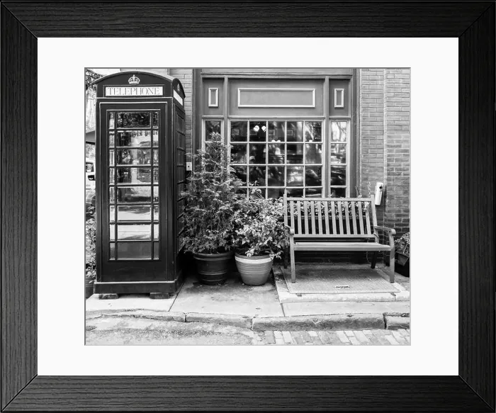 Framed Print : Classic vintage red telephone booth and empty bench Framed Print : Classic vintage red telephone booth and empty bench