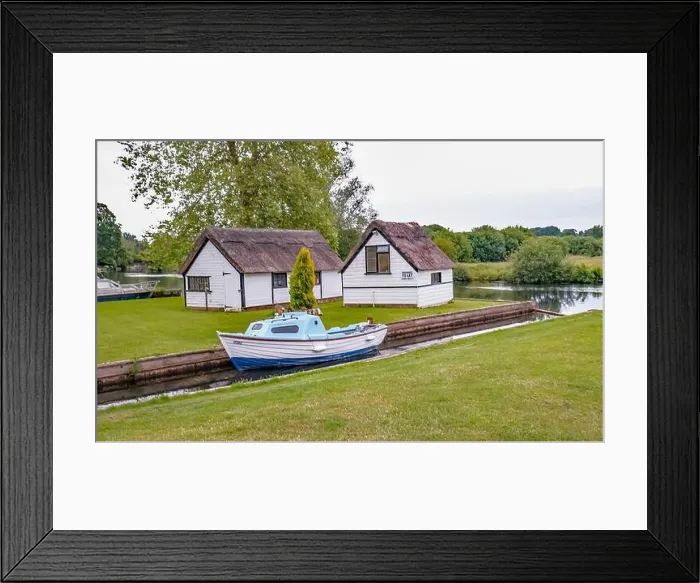 Framed Print : Private mooring dyke and boat house off the River Bure in the village of Coltishall in the heart of the Norfolk Broads