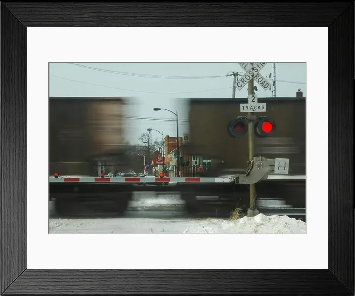 Framed Print : gate down at railroad crossing cars blurred Framed Print : gate down at railroad crossing cars blurred