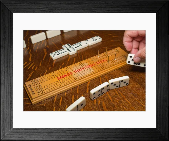 Framed Print : Game of dominoes using cribbage board to keep score Framed Print : Game of dominoes using cribbage board to keep score