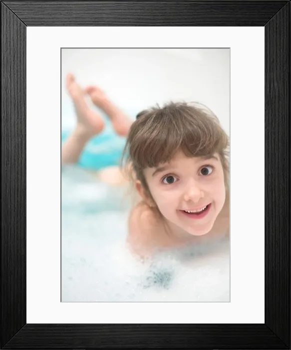 Framed Print : Portrait of girl smiling in bathtub Framed Print : Portrait of girl smiling in bathtub