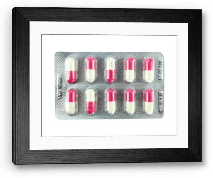 Framed Print : Pink and white pill on a white background Framed Print : Pink and white pill on a white background