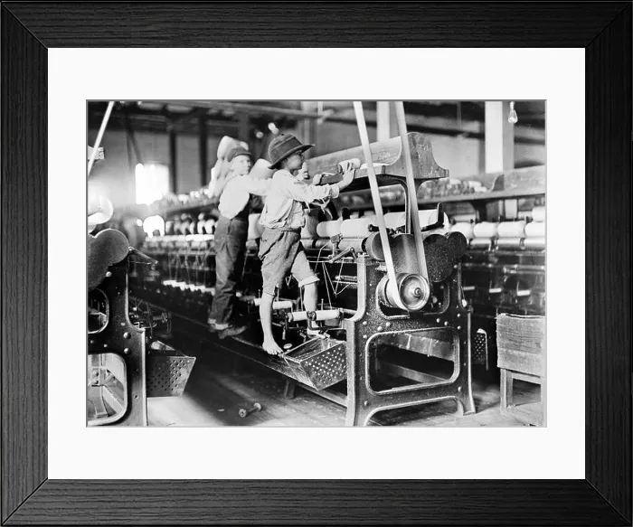 Framed Print : Doffer Boys, Macon, Georgia by Lewis Hine (1874-1940), 1908. The photograph shows young boys working in a cotton mill as child labor Framed Print : Doffer Boys, Macon, Georgia by Lewis Hine (1874-1940), 1908. The photograph shows young boys working in a cotton mill as child labor