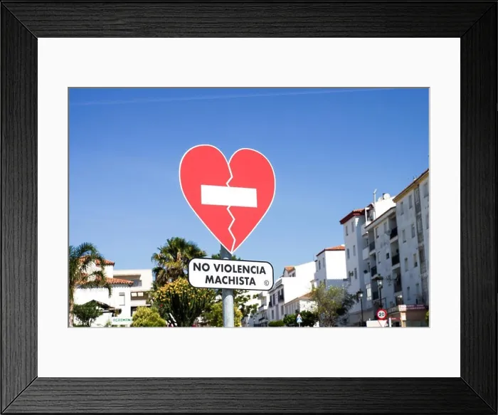 Framed Print : Heart-shaped traffic sign No Violencia Machista installed in an awareness campaign against domestic violence in Manilva - Malaga province, Spain Framed Print : Heart-shaped traffic sign No Violencia Machista installed in an awareness campaign against domestic violence in Manilva - Malaga province, Spain