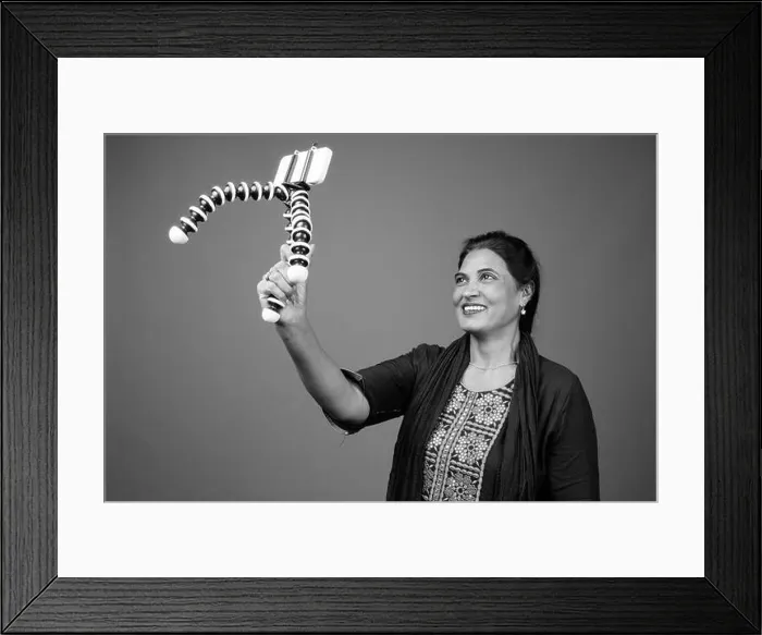 Framed Print : Happy mature beautiful Indian woman vlogging with phone Framed Print : Happy mature beautiful Indian woman vlogging with phone