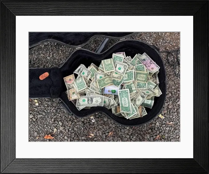 Framed Print : Street performers guitar case filled with dollar bills Framed Print : Street performers guitar case filled with dollar bills